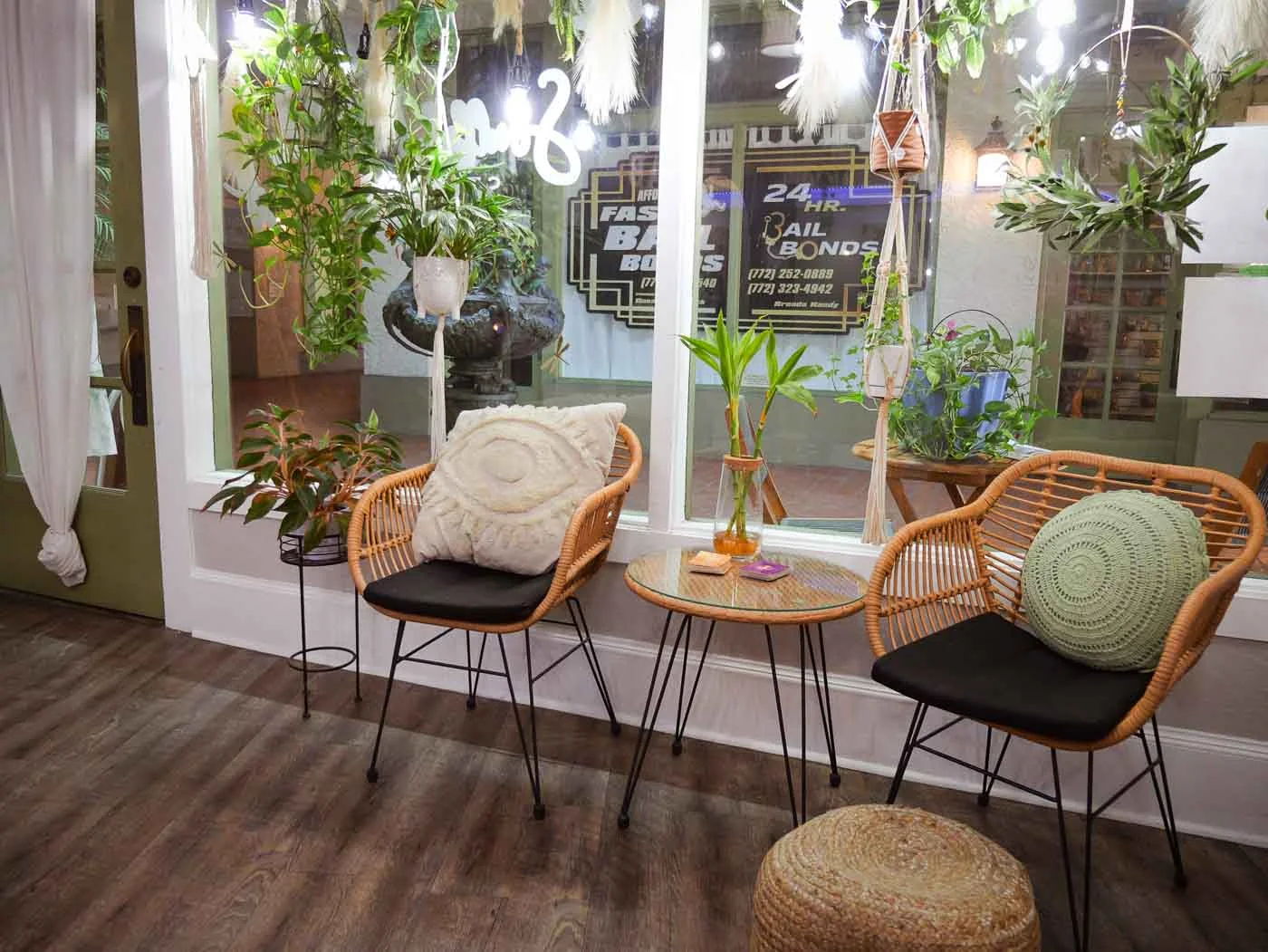 Rattan chairs and cushions in the waiting area by the front window